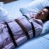 Person in bed, sleep paralysis illustration, paranormal themes